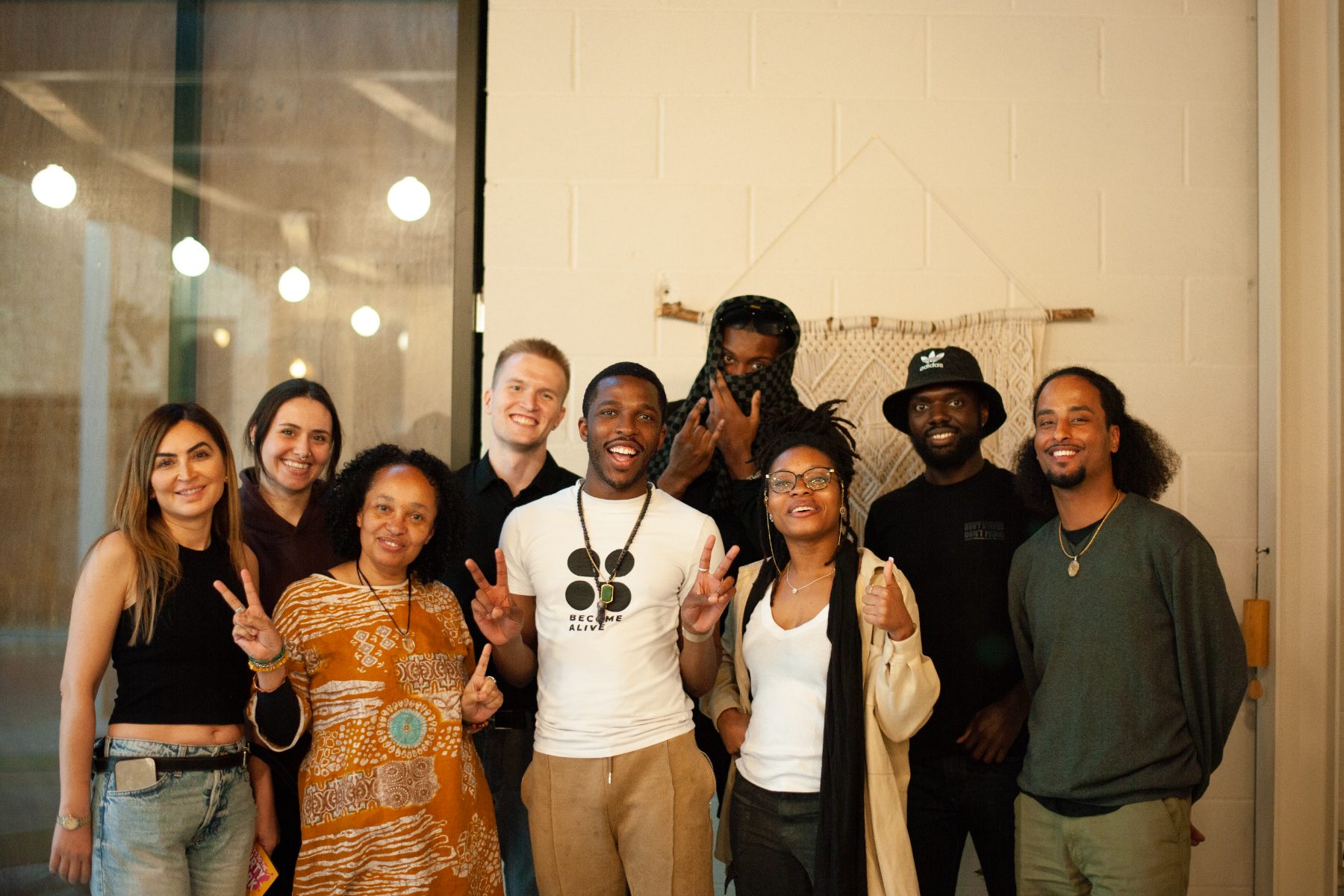 Washington with the Become Alive community, peace signs up