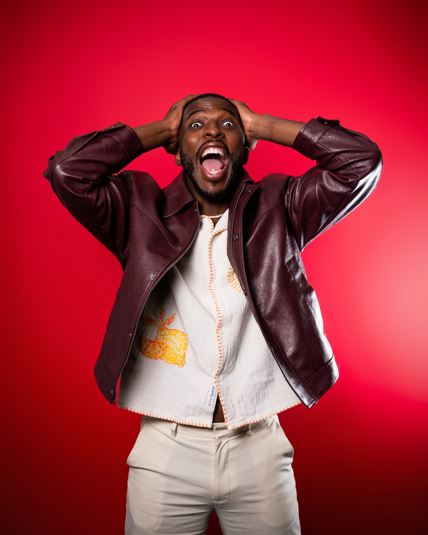 Washington with hands on his head, mouth wide open in delighted shock